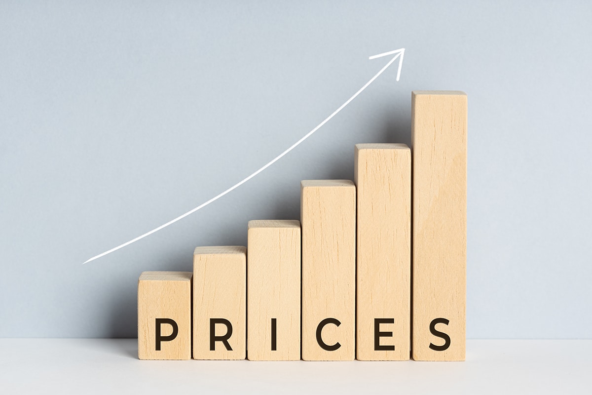 Increasing or Rising prices concept. Wooden block bar chart grap